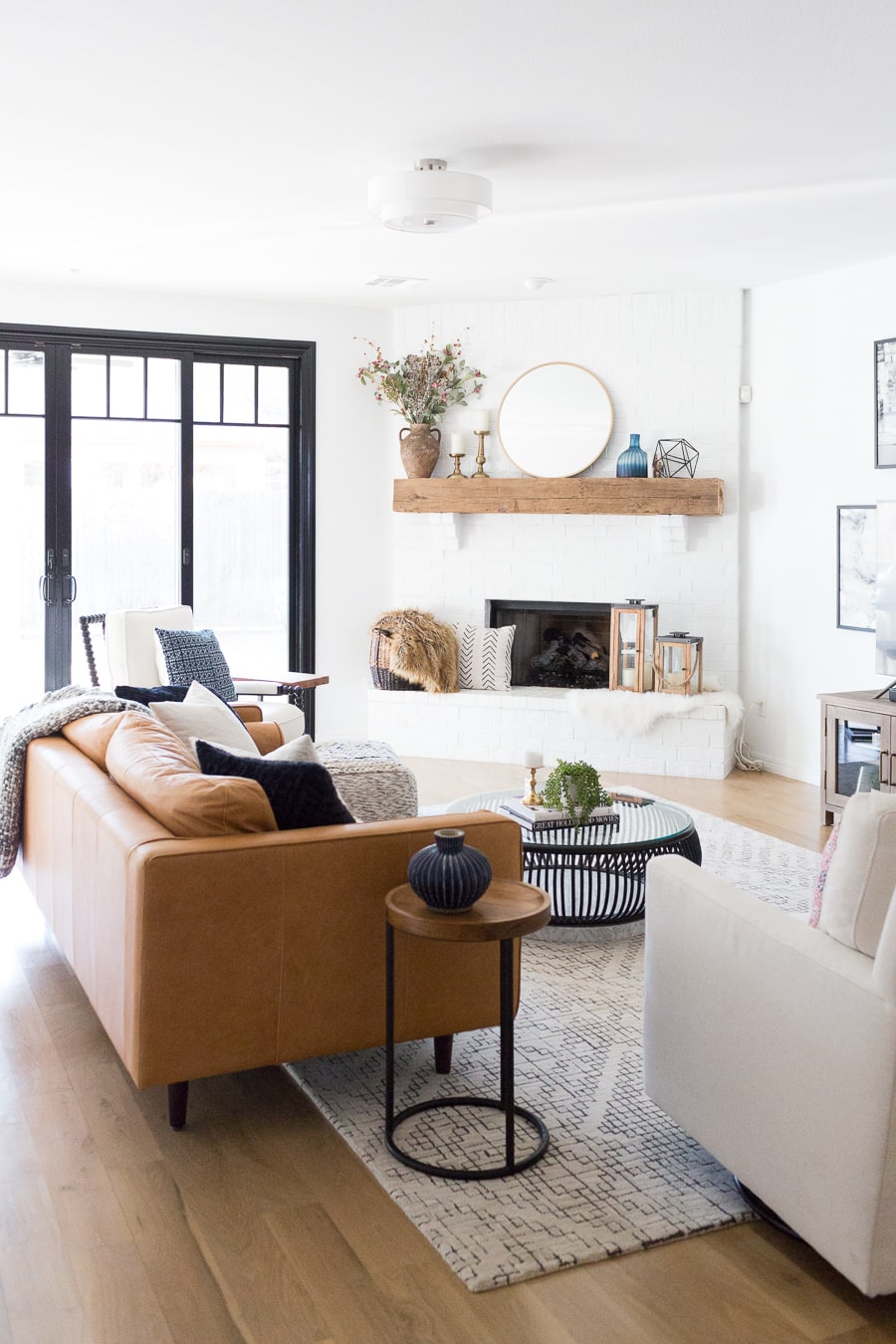 CC and Mike - painted brick fireplace surround with reclaimed wood mantel 