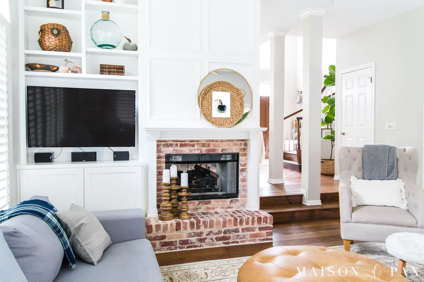 gray living room with simple fall decor touches like velvet pumpkins