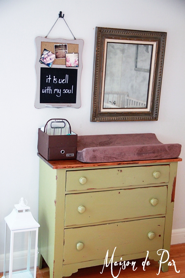 an adorable farmhouse dresser makes a bold statement in a natural green