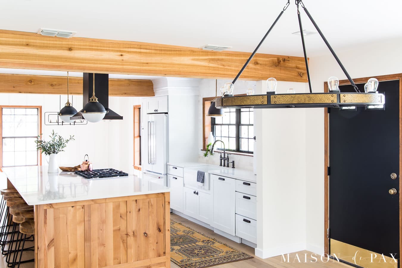 industrial rustic wagon wheel chandelier with brass and black | Maison de Pax