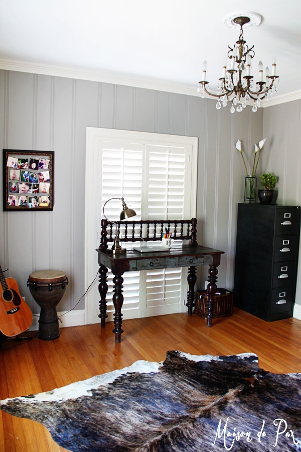 choosing the right color: a soft, warm gray brings light and comfort to a paneled office