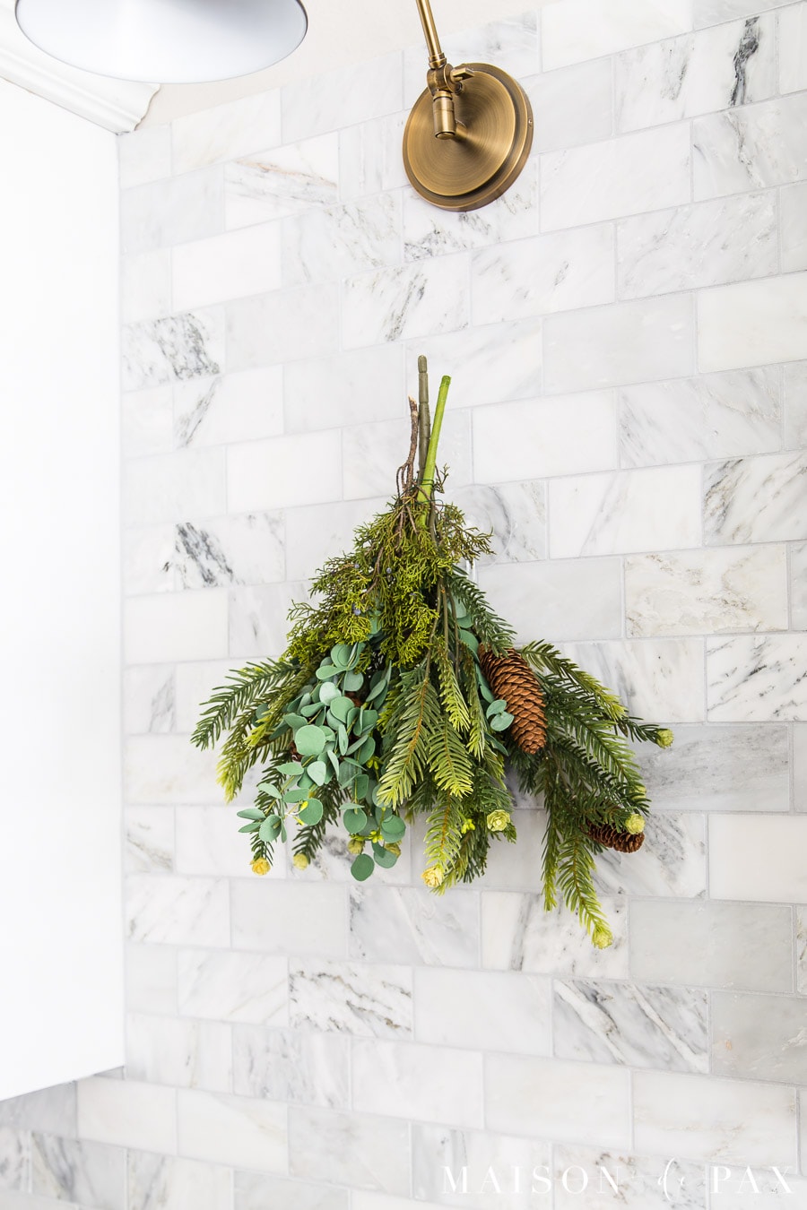 super easy holiday swag hanging on marble kitchen backsplash- Maison de Pax