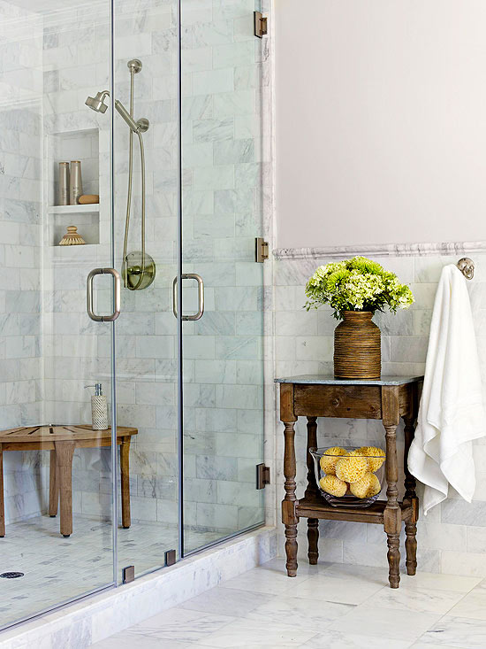 antique wood table beside marble shower