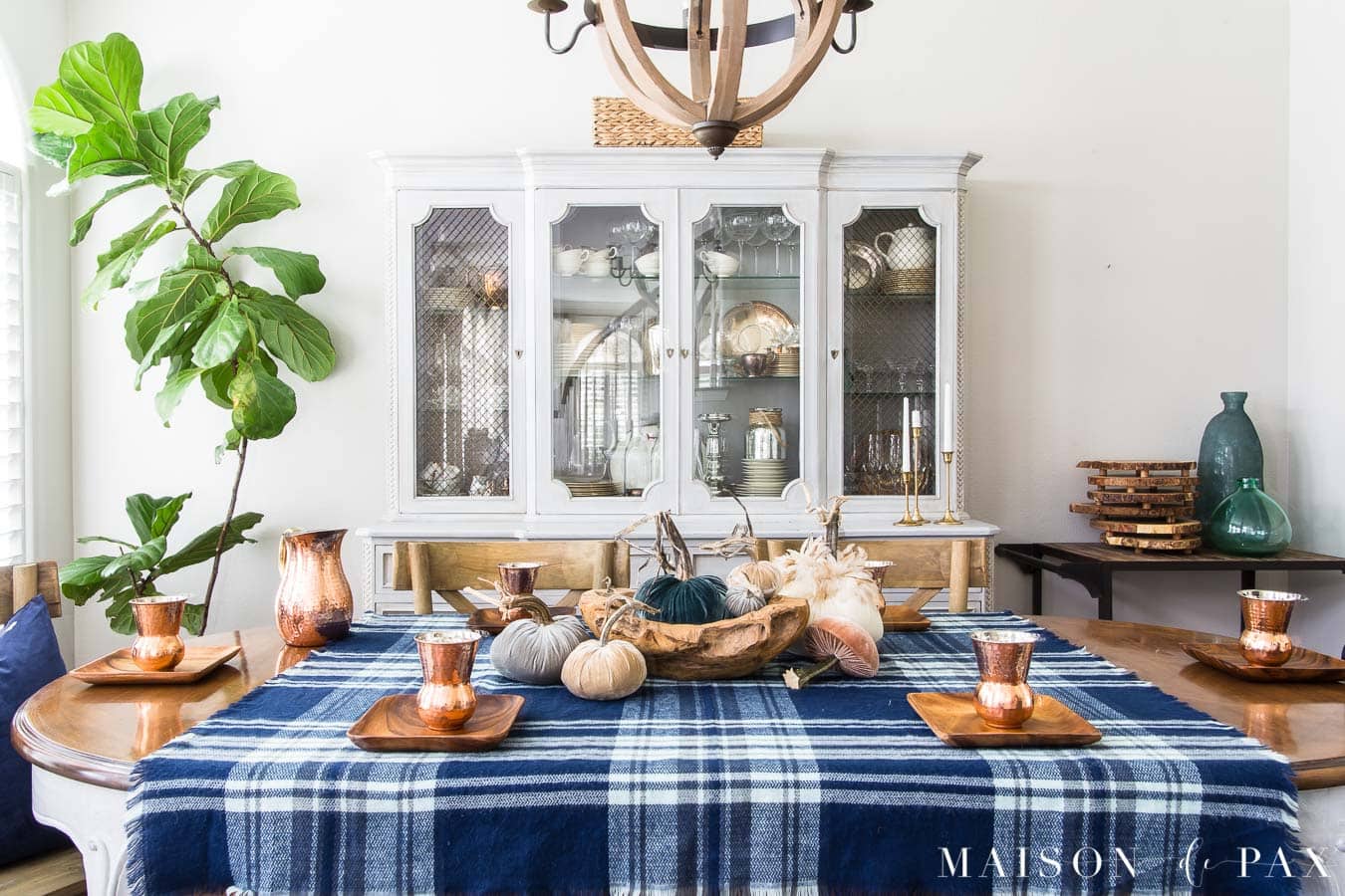 fall table with velvet pumpkins and blue plaid tablecloth