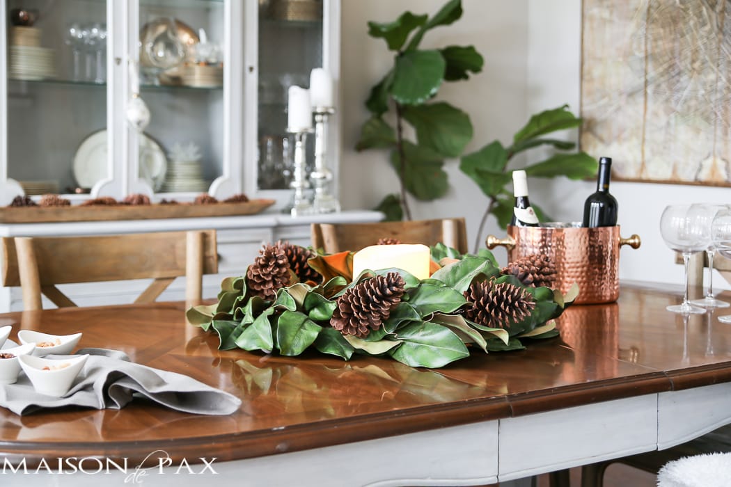 simple greenery and mercury glass makes this French farmhouse style dining room all set for Christmas!