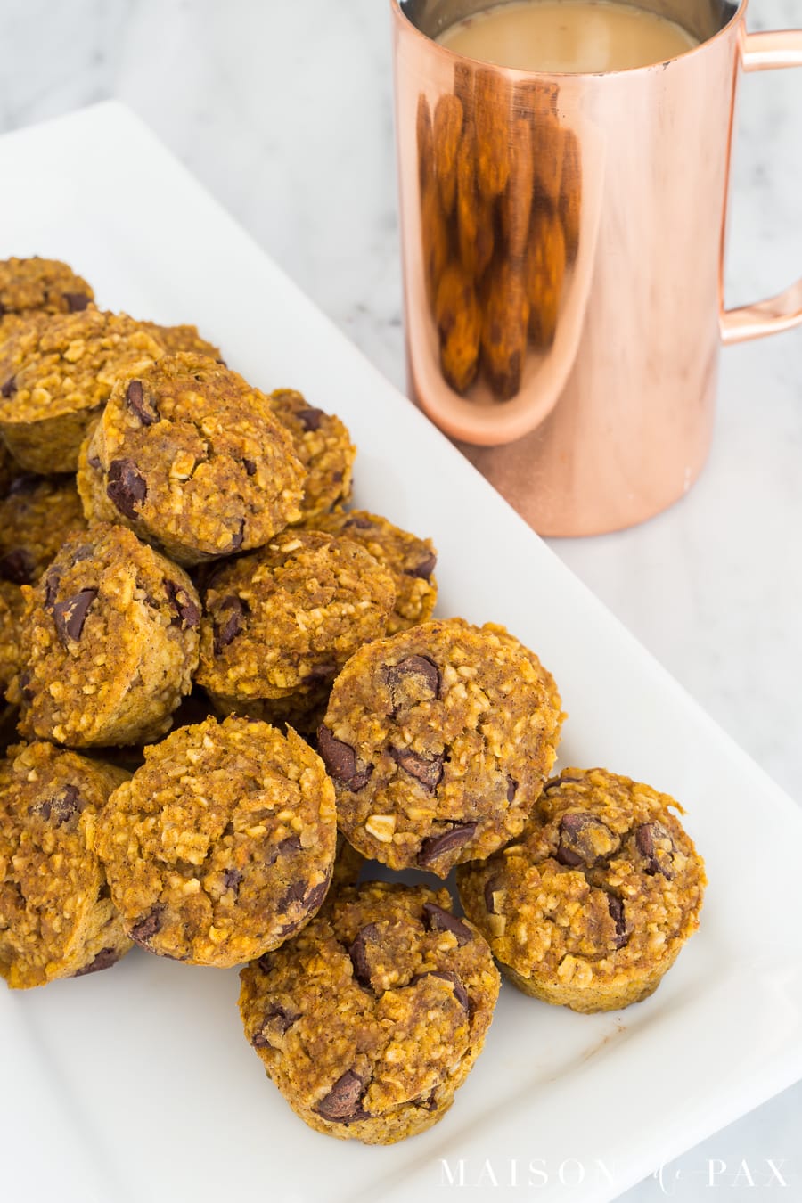 Gluten free pumpkin mini muffins: Made with applesauce and a touch of maple syrup for sweetening, oat flour, and pumpkin, these are packed with delicious flavor and nutritious ingredients #gf #glutenfree #pumpkinspice #fallrecipe #pumpkinrecipe #pumpkinmuffins #breakfast #gfbreakfast 