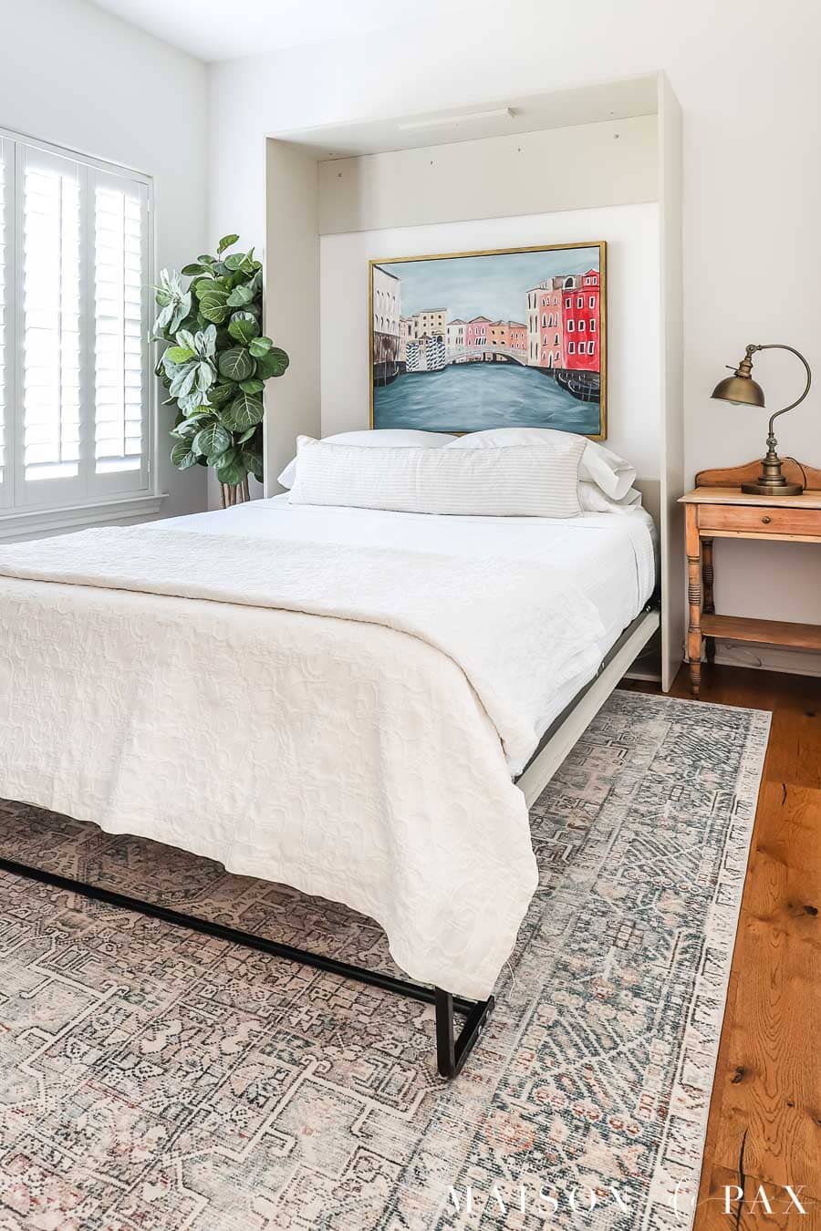 murphy bed with canvas art inside