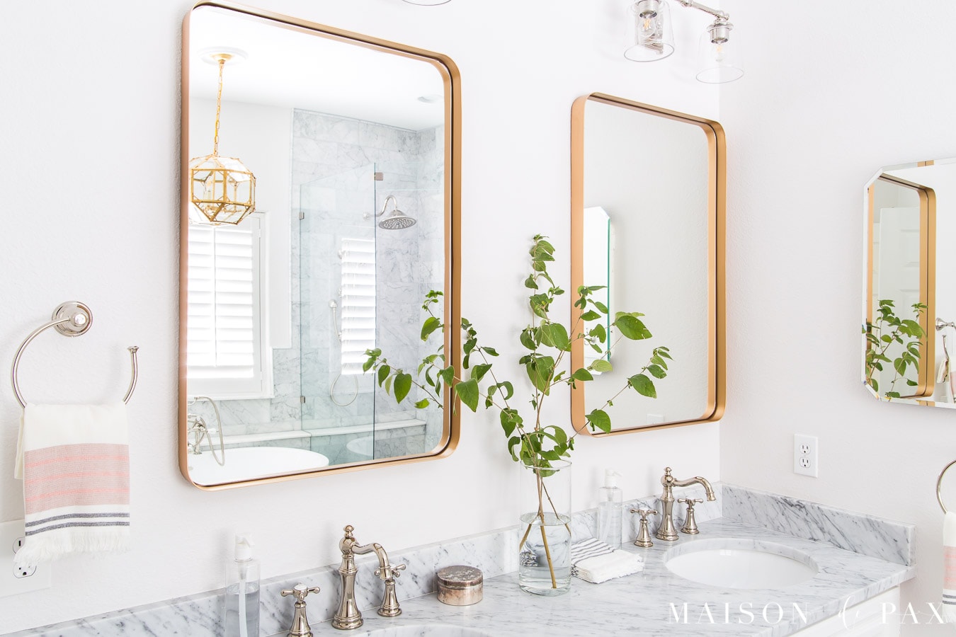 modern gold framed bathroom mirror with marble countertops | Maison de Pax