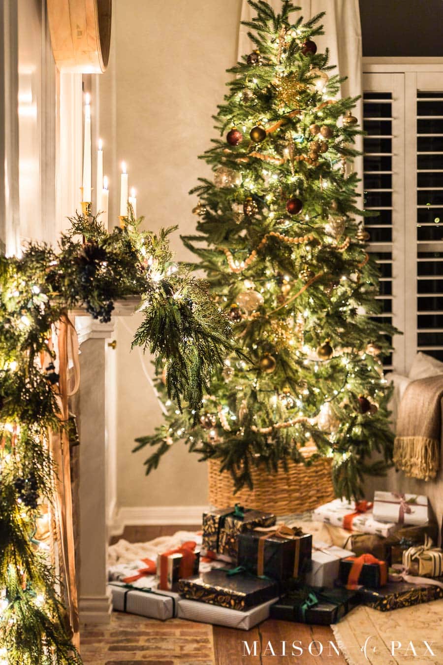 candlelight and twinkle lights at night with Christmas tree