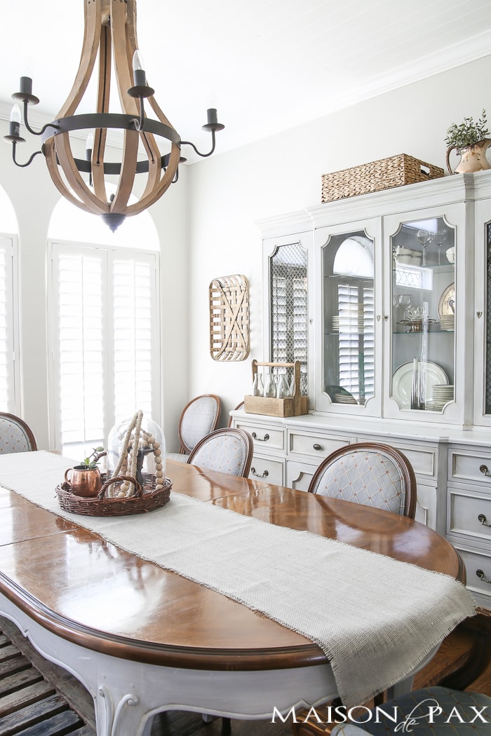 Love the wine barrel chandelier and the lovely grey French farmhouse dining room! Beautiful summer home tour with lots of whites, raw wood tones, and simple decorating ideas
