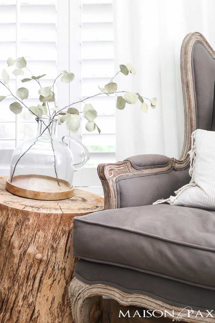 Love the raw wood trunk side table- Maison de Pax