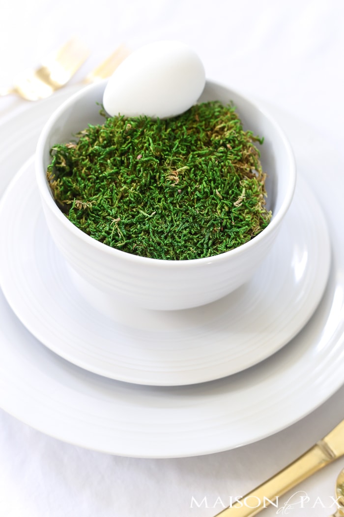 Green and White Easter decorating centerpiece with  moss and gold flatware - Maison de Pax