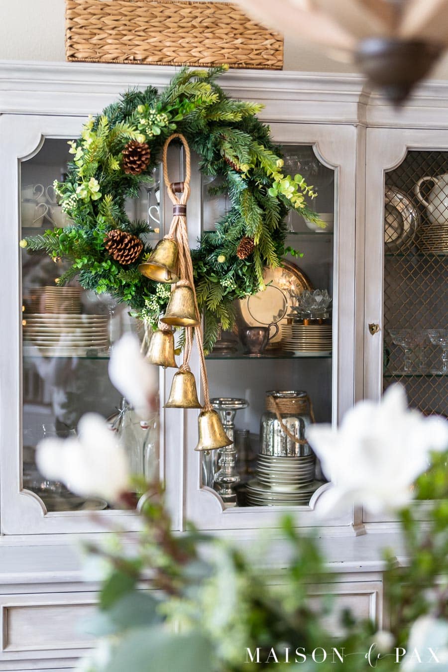 green wreath with gold bells