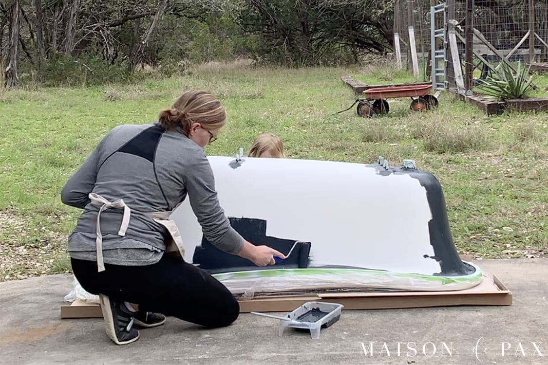 painting the outside of a clawfoot tub with a roller | Maison de Pax