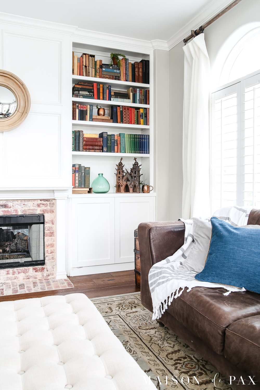 White painted built-in bookcase with antique books- Maison de Pax