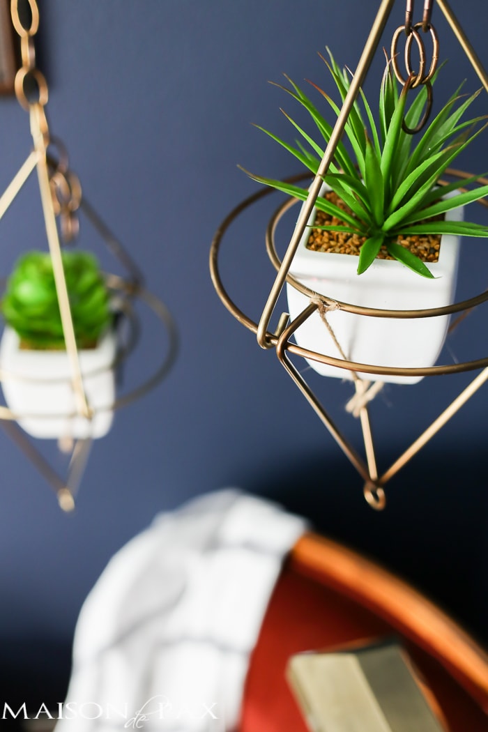 Love this dark, moody, navy office with red and brass accents