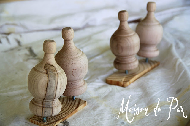 TIP: Screw knobs or finials into scrap wood before staining or painting to get an even finish
