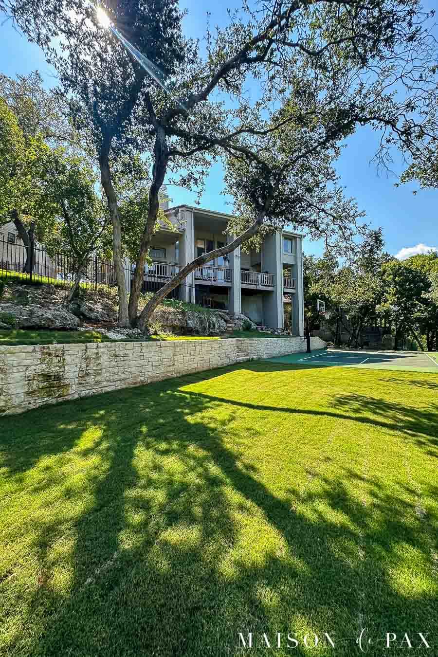 Backyard renovation - after leveling, building retaining wall, and installing sport court