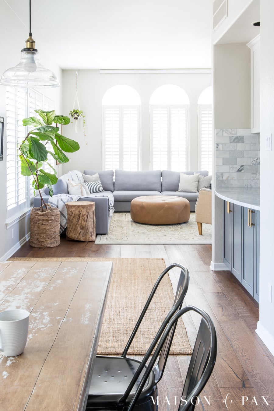 Bright living room design with sectional- Maison de Pax