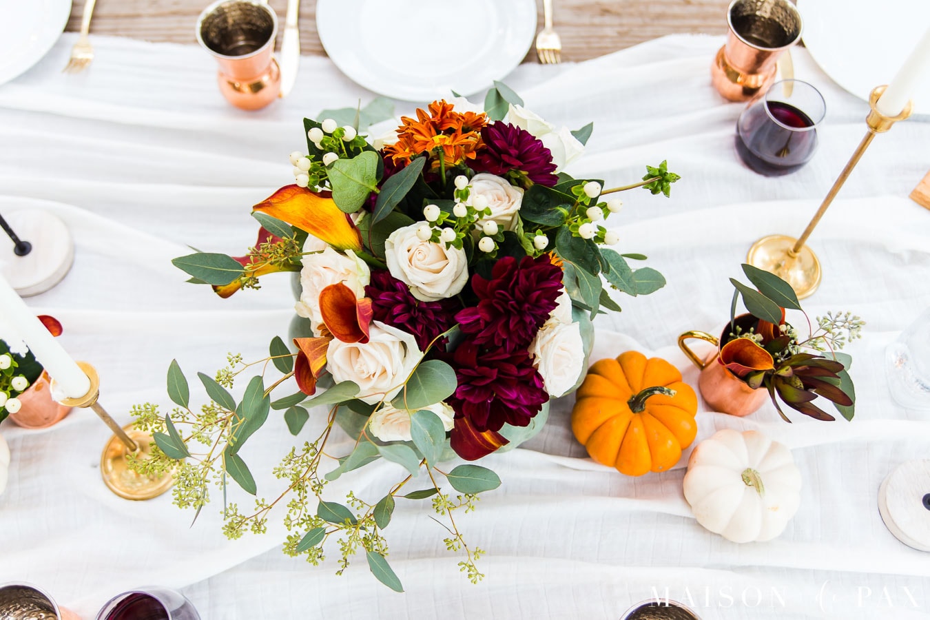 fall floral centerpiece and mini pumpkins on thanksgiving table | Maison de Pax