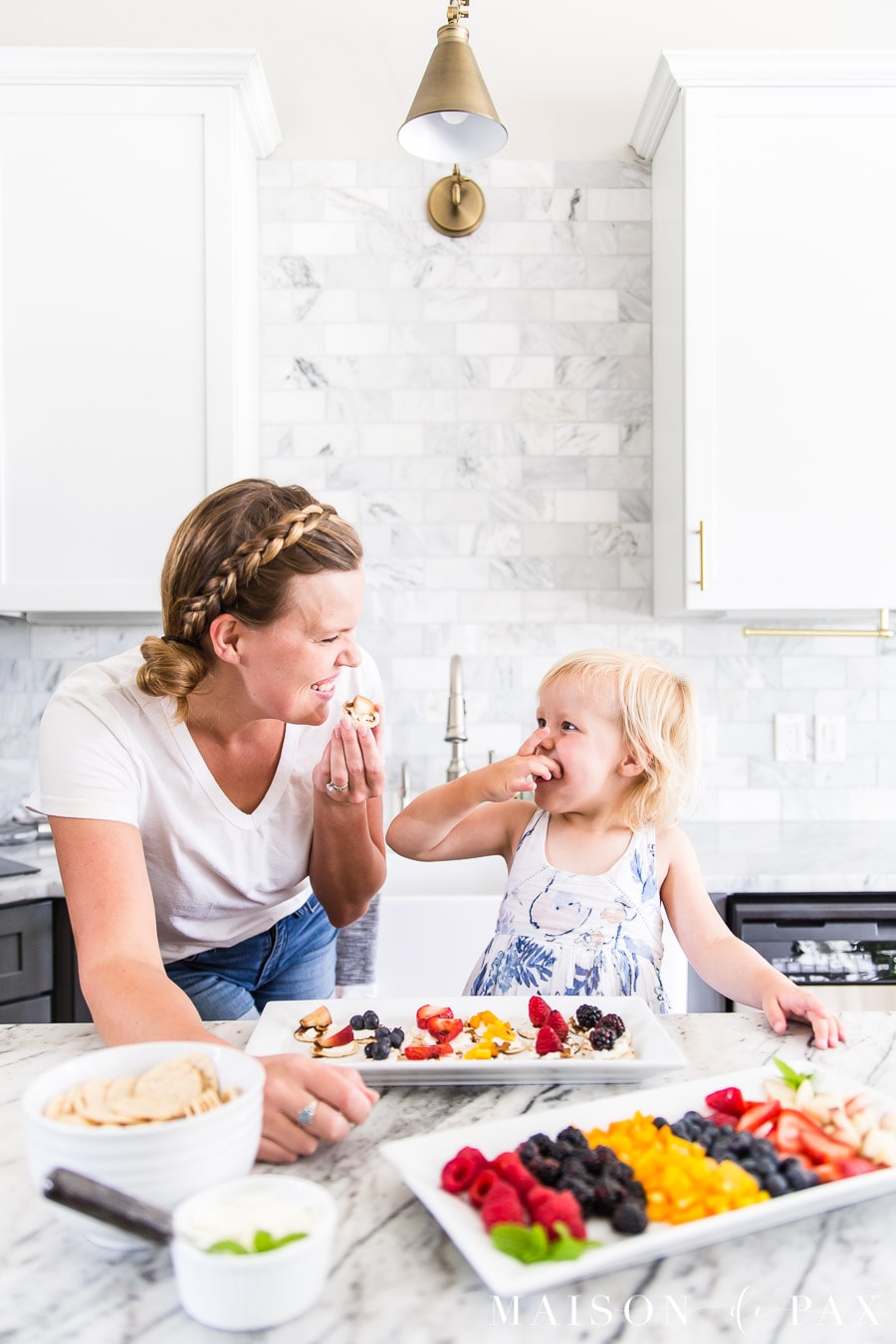 woman and girl enjoying a beautiful appetizer spread | Maison de Pax