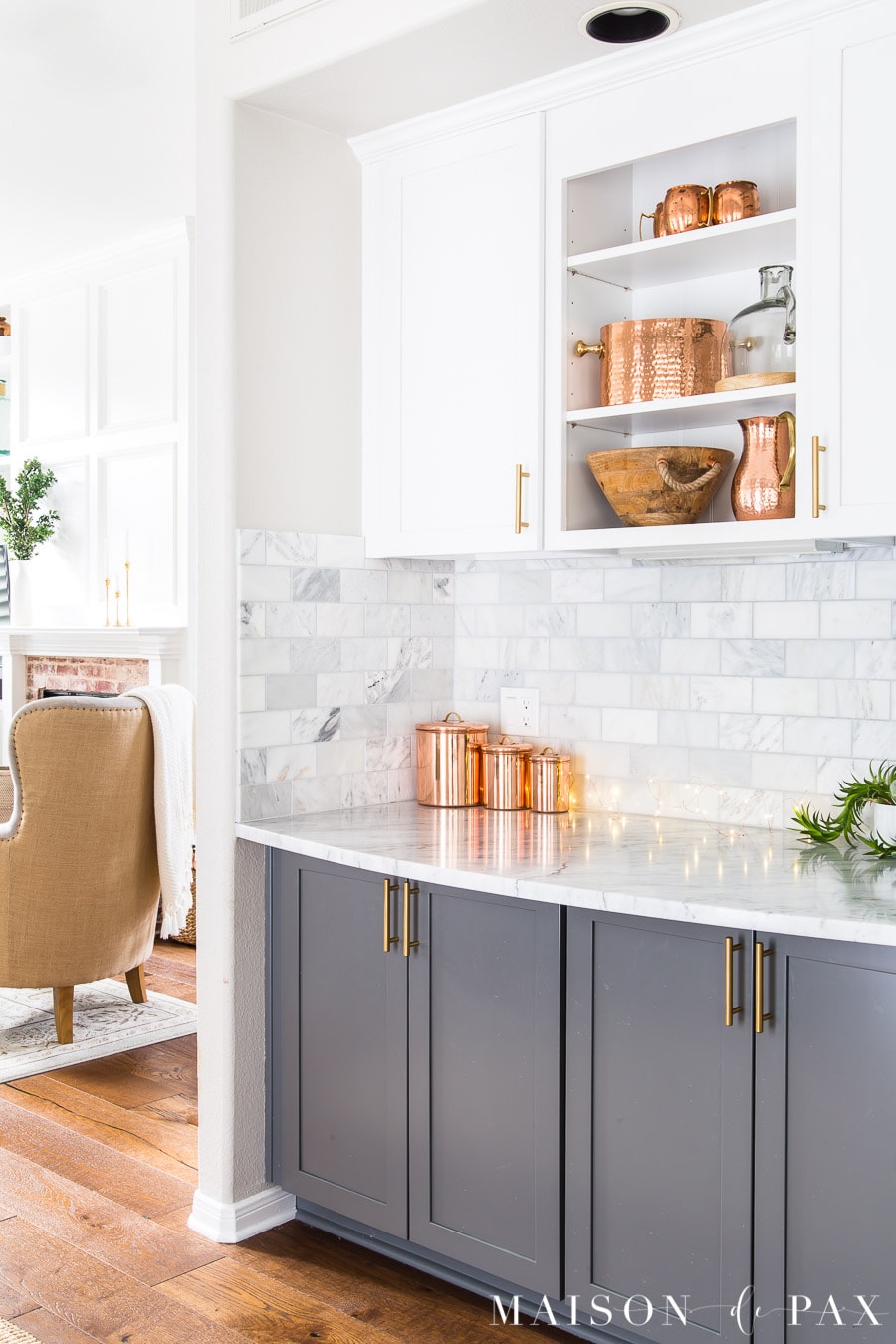 Agreeable Gray walls with white and gray cabinets and cararra marble tile and countertops | Maison de Pax