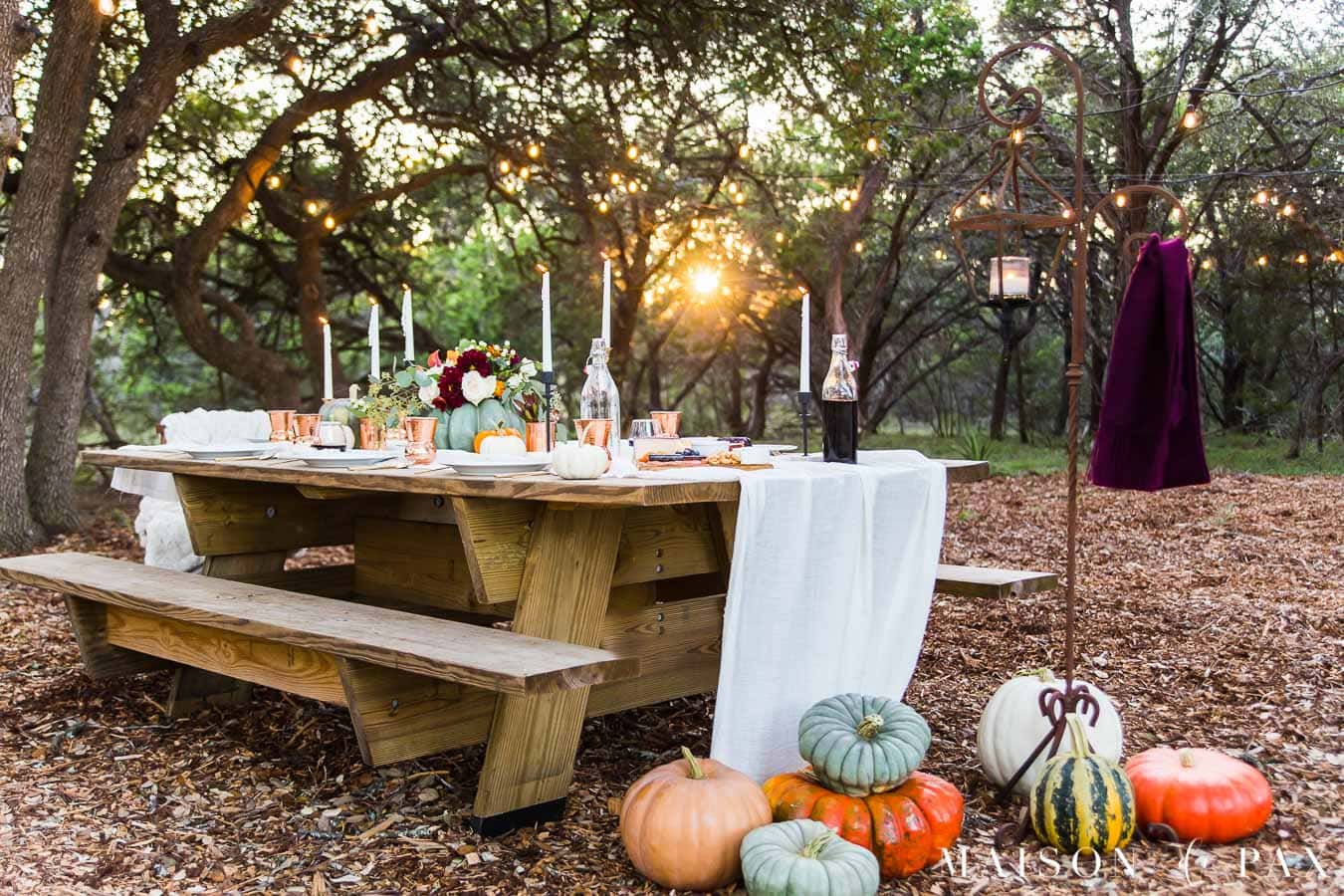 outdoor friendsgiving table with pumpkins | Maison de Pax