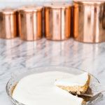 pumpkin cheesecake with sour cream topping in glass pie pan | Maison de Pax