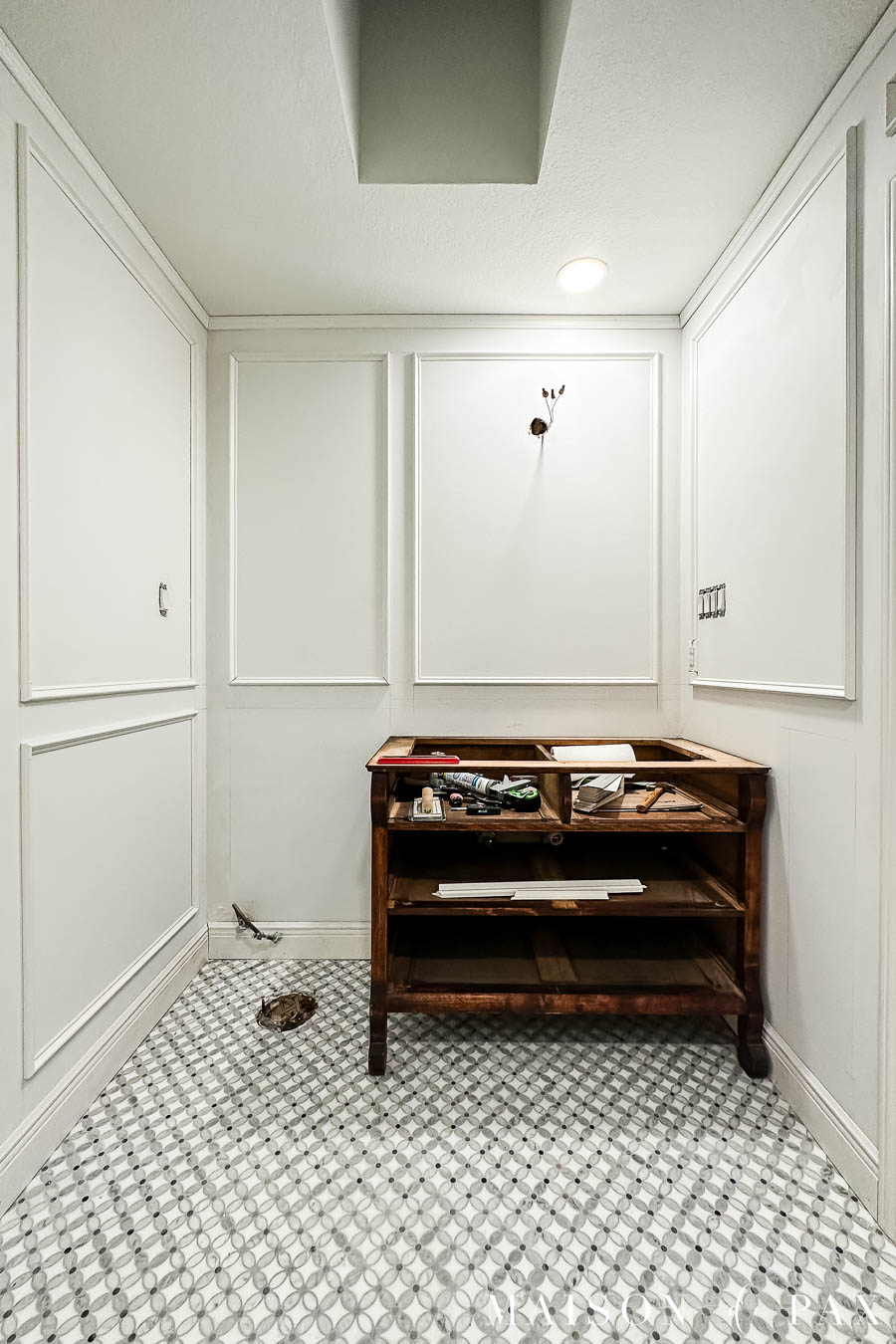 DIY picture frame molding in a small bathroom