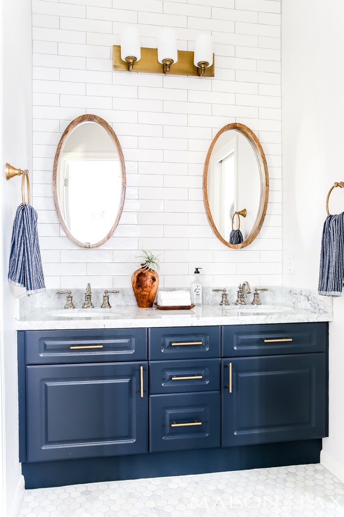 Navy and white bathroom with brass and wood accents- Maison de Pax