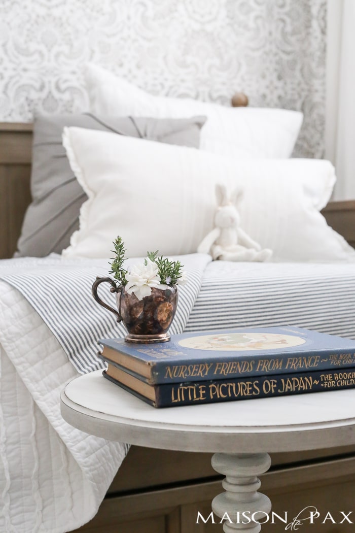 Elegant, neutral little girl room with wood tones and a stenciled accent wall: A gray-washed trundle bed provides the perfect anchor for a gorgeous, neutral yet feminine little girl's room.