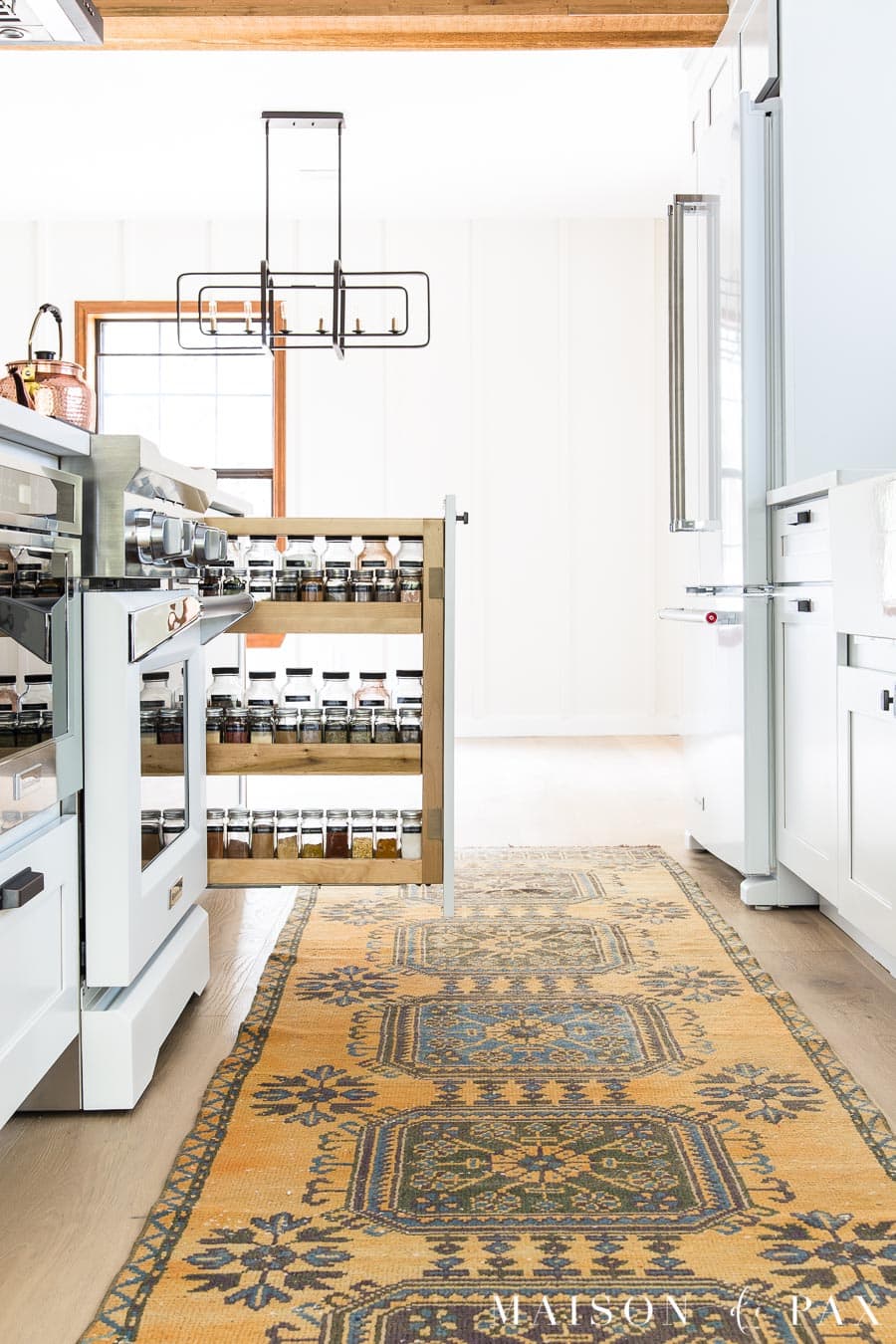 organized spice pull out beside stove modern farmhouse kitchen | Maison de Pax
