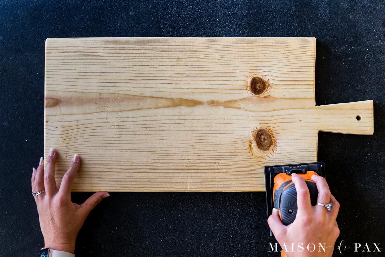 Sanding smooth edges of a pine common board for a cutting board | Maison de Pax