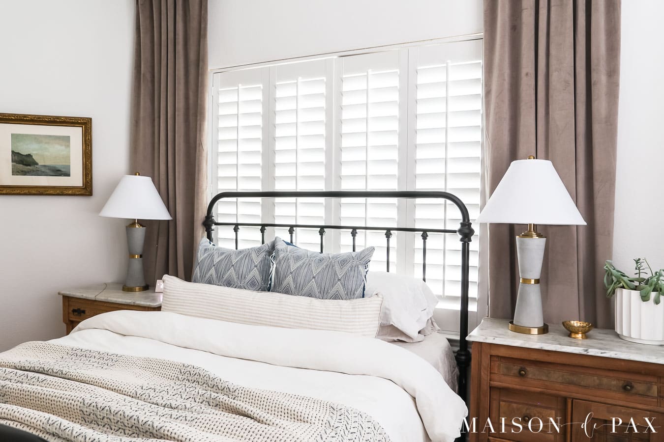 vintage artwork with antique gold frame in master bedroom