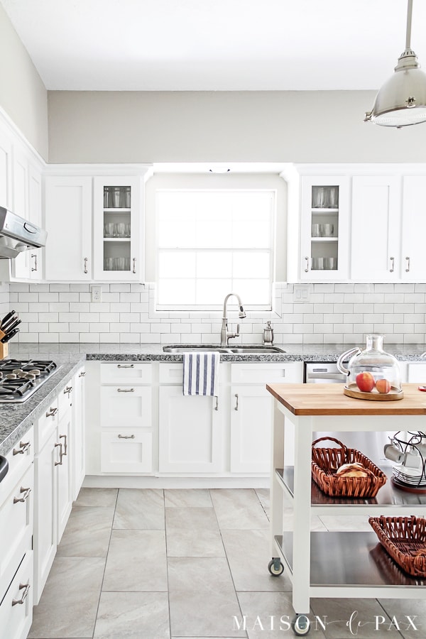 white kitchen with subway backsplash and delorean gray grout