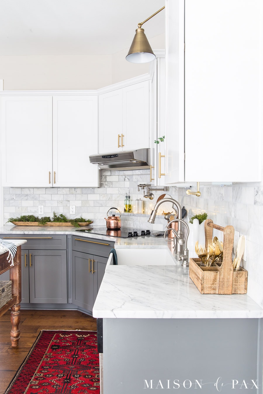 marble countertops and two tone cabinets with Agreeable Gray walls | Maison de Pax