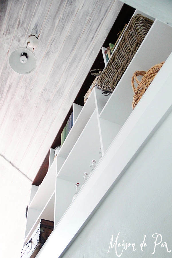 A DIY stairwell bookcase provides a creative and beautiful way to open the space and bring light into the stairwell.  Click through to see details and instructions!