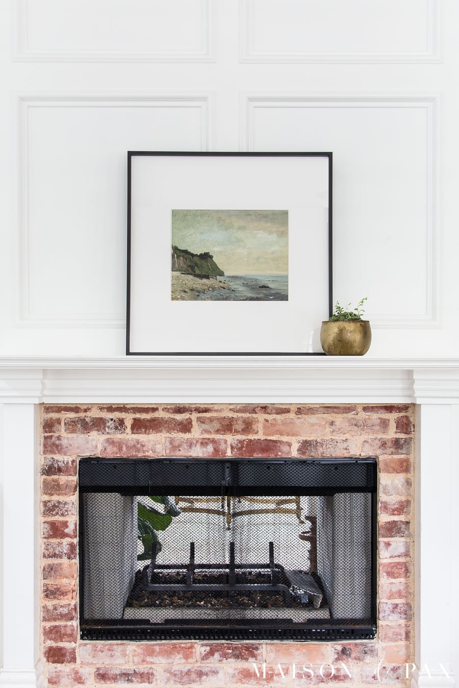 large art piece (vintage: beach scene) and potted succulent above mantel | Maison de Pax