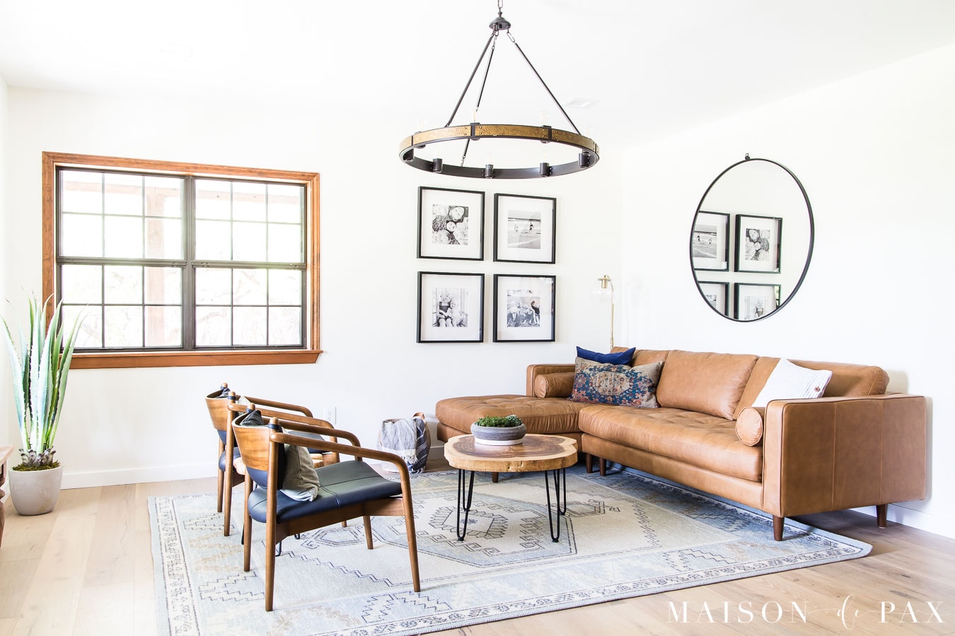 gallery wall, wagon wheel chandelier, modern farmhouse living room | Maison de Pax