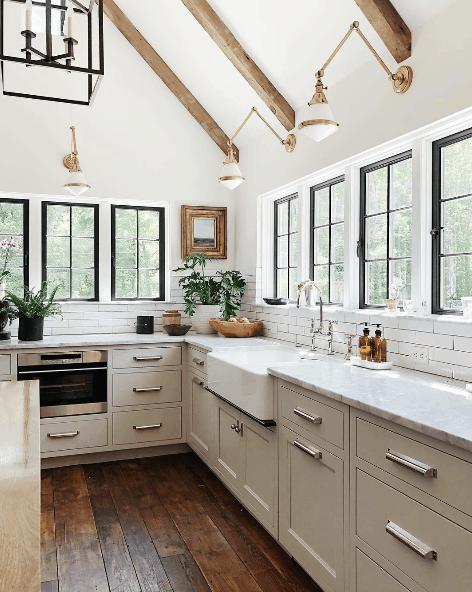 Jean Stoffer Design kitchen: white walls, black windows, rustic beams, farmhouse sink- Maison de Pax