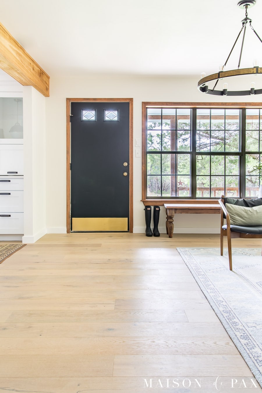 entry way with bench and wide plank floors in modern farmhouse living room | Maison de Pax