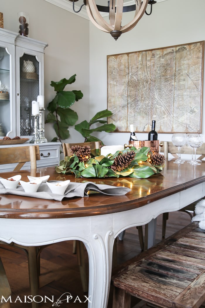 simple greenery and mercury glass makes this French farmhouse style dining room all set for Christmas!