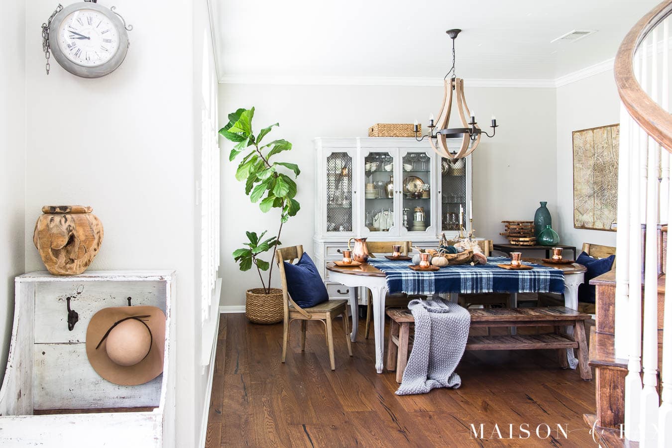 gray fall dining room with blue velvet and plaid tablescape