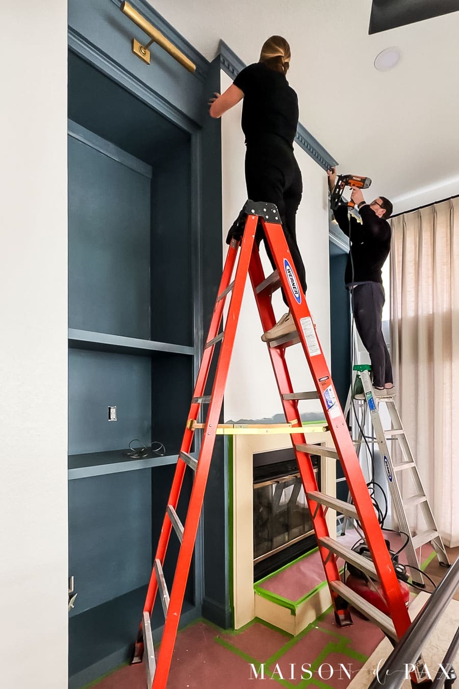 adding crown molding above a fireplace to tie it into flanking bookcases