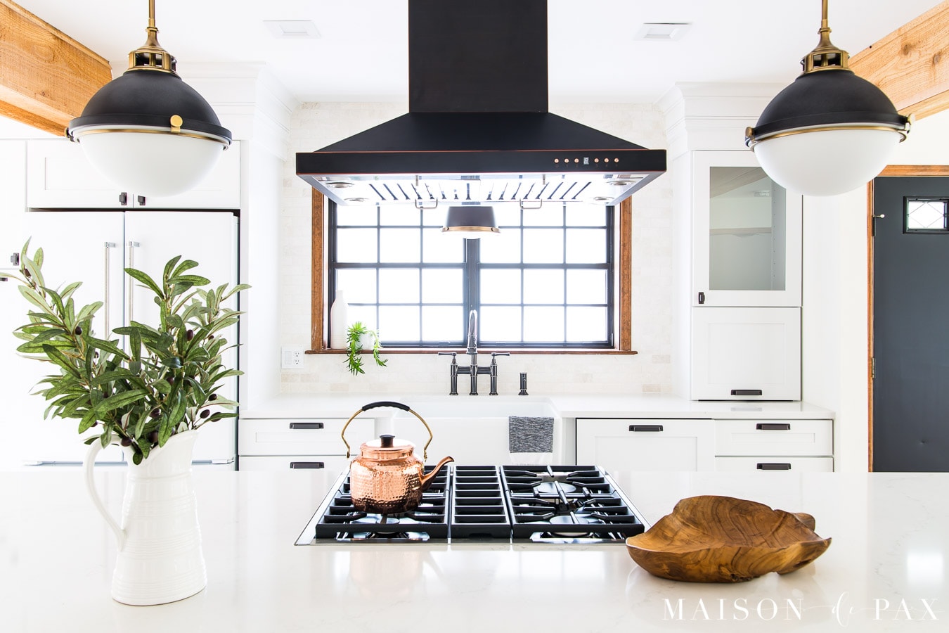 black and white globe lights over kitchen island | Maison de Pax