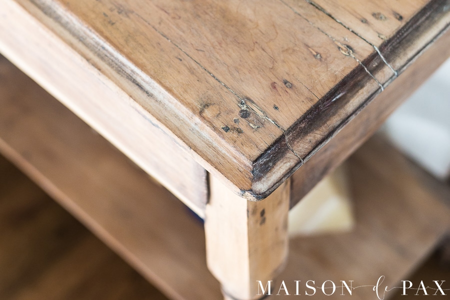 edge of an antique nightstand that has been finished with a stripped, raw wood look- Maison de Pax