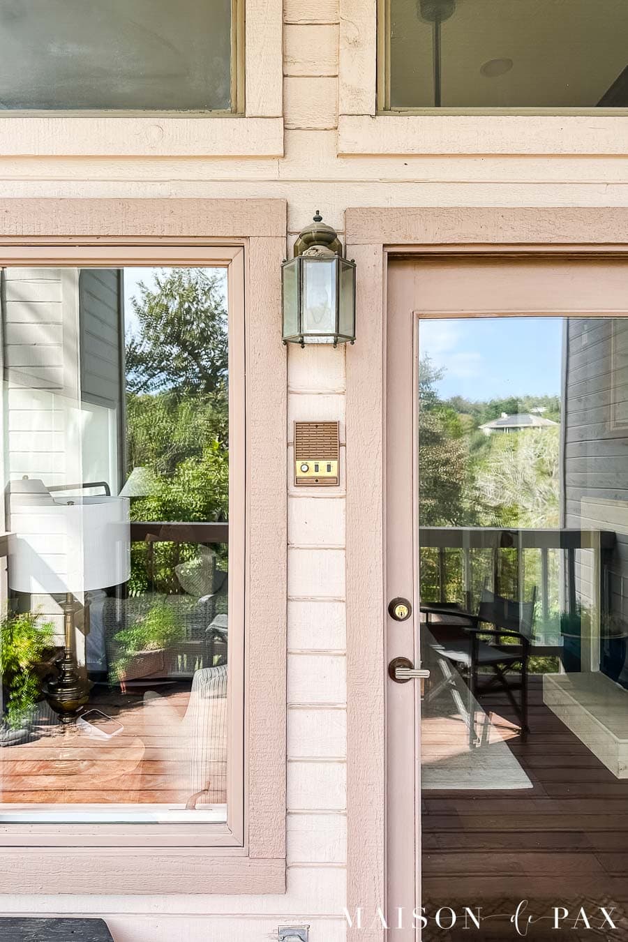 outdoor sconce in a tight space between two doorways