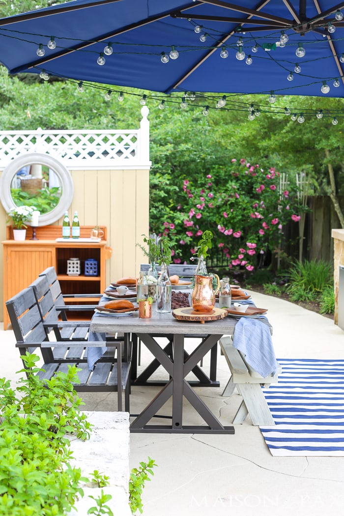 globe string lights bring instant ambiance to an outdoor dinner party