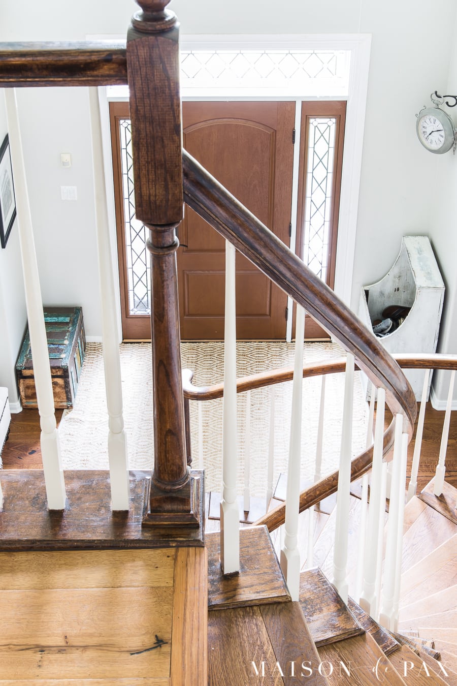 two story entryway and stairs with wood floors and light gray walls | Maison de Pax