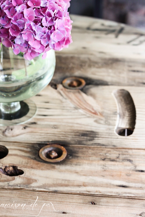 DIY Industrial Spool Table with a vase of hydrangeas- Maison de Pax 